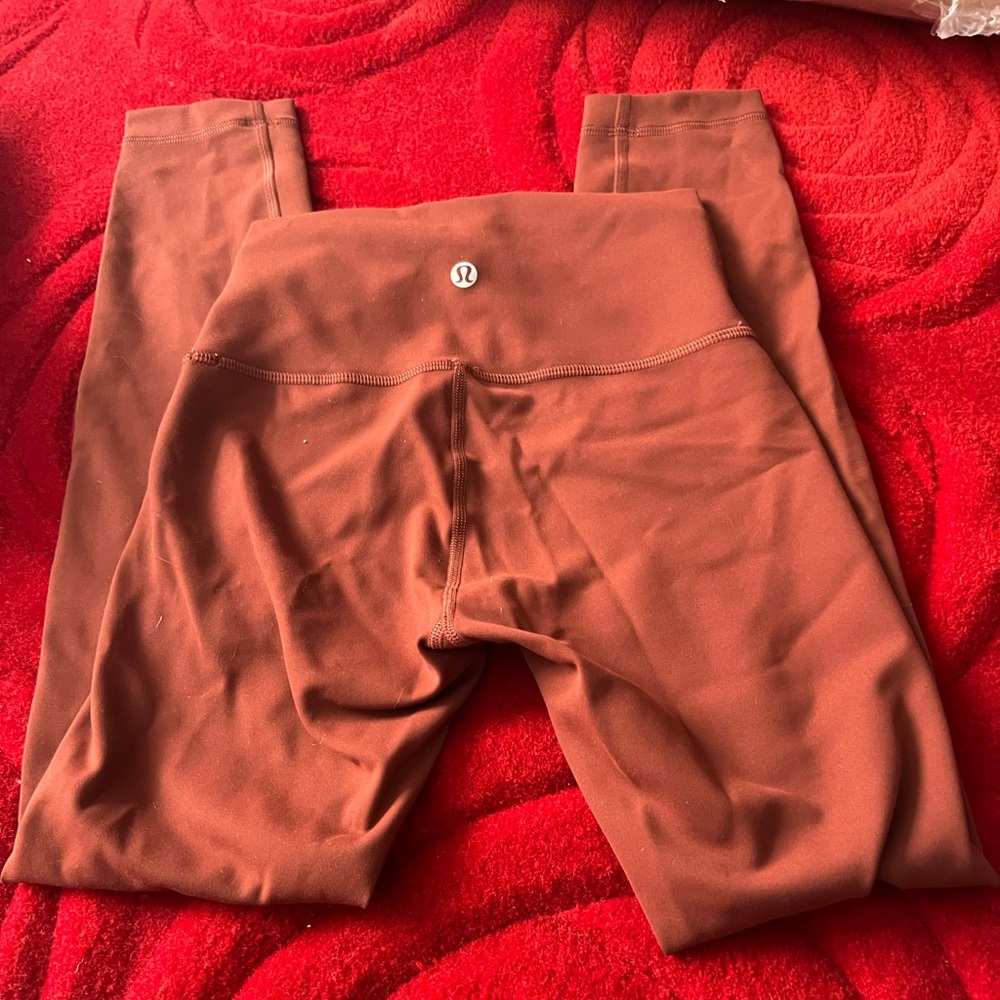 Lululemons rust color crops size 2. Never worn no tags